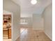 An open floor plan features ceramic tile floors and access to the kitchen and living room at 2990 Mallard Dr, Deltona, FL 32738