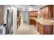 Spacious kitchen with stainless steel refrigerator and plenty of cabinet space at 2990 Mallard Dr, Deltona, FL 32738