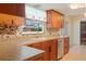 A well-appointed kitchen boasts wood cabinets, stylish backsplash and modern appliances for gourmet cooking at 2990 Mallard Dr, Deltona, FL 32738