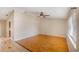 Spacious living room with vaulted ceilings, ceiling fan, and wood-look flooring for a modern design at 2990 Mallard Dr, Deltona, FL 32738