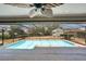 Spacious screened-in pool and lounge area with ceiling fans at 2990 Mallard Dr, Deltona, FL 32738