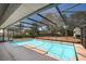 Large screened-in pool and deck provides refreshing relaxation and enjoyment at 2990 Mallard Dr, Deltona, FL 32738