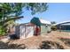 Backyard storage shed painted green offers an effective outdoor storage solution at 2990 Mallard Dr, Deltona, FL 32738