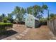 Green backyard shed providing ample storage space and a charming aesthetic at 2990 Mallard Dr, Deltona, FL 32738