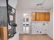 Utility room with washer/dryer hookups, storage cabinets, and a view to the pool at 2990 Mallard Dr, Deltona, FL 32738