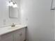 Bathroom featuring a white vanity with a sink, a mirror, and lighting fixtures for a clean aesthetic at 3019 Page Ave, Orlando, FL 32806