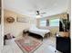 Bright bedroom with a ceiling fan, decorative rug, and natural light at 3019 Page Ave, Orlando, FL 32806