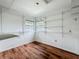 Spacious walk-in closet with built-in shelving and wood floors, offering ample storage space at 3019 Page Ave, Orlando, FL 32806