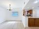 Open dining area features a chandelier and easy access to the adjacent kitchen at 3019 Page Ave, Orlando, FL 32806