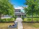 Beautifully landscaped home with mature trees and a well-maintained front yard at 3019 Page Ave, Orlando, FL 32806