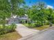Charming two-story home with mature landscaping and a long, inviting driveway at 3019 Page Ave, Orlando, FL 32806
