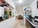 Cozy kitchen with a view into the dining room and living room, ideal for entertaining at 3019 Page Ave, Orlando, FL 32806