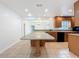 Large kitchen island and plenty of counter space for cooking and gathering at 3019 Page Ave, Orlando, FL 32806
