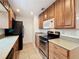 Well-equipped kitchen with stainless steel appliances and plenty of cabinet space at 3019 Page Ave, Orlando, FL 32806