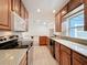 Modern kitchen with stainless steel appliances and granite countertops overlooking a separate dining area at 3019 Page Ave, Orlando, FL 32806