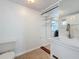 This laundry room features a utility sink, tiled floors, and built-in storage at 3019 Page Ave, Orlando, FL 32806