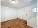 Bright living room features modern wood floors and ample natural light from the front door window at 3019 Page Ave, Orlando, FL 32806