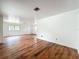 Bright living room featuring wood floors, white walls and a window allowing for ample natural light at 3019 Page Ave, Orlando, FL 32806