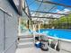 A screened-in pool with lounge chairs and easy access from the main home at 3019 Page Ave, Orlando, FL 32806