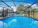 Enclosed pool featuring a sparkling pool with lots of space for entertaining and a view of the home at 3019 Page Ave, Orlando, FL 32806