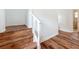 Close up of the staircase showing the wood stairs and white railing at 3019 Page Ave, Orlando, FL 32806