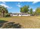 The backyard features ample green space and views of the property's rear exterior at 315 Tulane Dr, Altamonte Springs, FL 32714