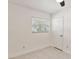 Bedroom with a window with white blinds, tile flooring and white walls at 315 Tulane Dr, Altamonte Springs, FL 32714