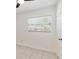 Bedroom with a window with white blinds, tile flooring and white walls at 315 Tulane Dr, Altamonte Springs, FL 32714