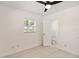Bedroom featuring tile flooring, a window with white blinds and an ensuite bathroom at 315 Tulane Dr, Altamonte Springs, FL 32714