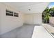 Attached carport with a concrete slab, additional storage, and easy access to the home at 315 Tulane Dr, Altamonte Springs, FL 32714