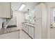 Bright kitchen boasts ample storage with white cabinets, granite countertops, and modern appliances at 315 Tulane Dr, Altamonte Springs, FL 32714