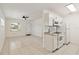 Bright kitchen with white cabinets, granite countertops, and stainless steel appliances is open to the living area at 315 Tulane Dr, Altamonte Springs, FL 32714