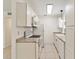 A well lit kitchen features white appliances and granite countertops, with light flooring at 315 Tulane Dr, Altamonte Springs, FL 32714