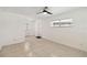 Open living room area with ceiling fan, white walls, and lots of natural light at 315 Tulane Dr, Altamonte Springs, FL 32714