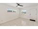 Bright living room with large window, ceiling fan, tile flooring, and neutral paint at 315 Tulane Dr, Altamonte Springs, FL 32714
