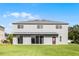 Large backyard with a well-maintained lawn and exterior of the home at 346 Willet Ave, Apopka, FL 32703