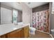 Bathroom with a single sink vanity and floral shower curtain at 346 Willet Ave, Apopka, FL 32703