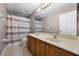 Bathroom with double vanity, shower, and tile floors at 346 Willet Ave, Apopka, FL 32703