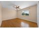 Sunlit bedroom with wood floors and a ceiling fan at 346 Willet Ave, Apopka, FL 32703