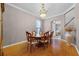 Formal dining room with hardwood floors, elegant chandelier, and large table at 346 Willet Ave, Apopka, FL 32703