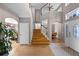 Grand entryway boasting high ceilings, hardwood floors, and a staircase leading to the upper level at 346 Willet Ave, Apopka, FL 32703