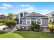 Beautiful exterior view of a well-maintained home with lush landscaping and a manicured lawn at 346 Willet Ave, Apopka, FL 32703