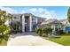 Stunning two-story home features a manicured lawn and beautiful landscaping at 346 Willet Ave, Apopka, FL 32703