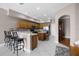 Kitchen with stainless steel appliances, island, bar stool seating and tile flooring at 346 Willet Ave, Apopka, FL 32703