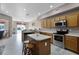 Open kitchen with stainless steel appliances, tile floors, and center island at 346 Willet Ave, Apopka, FL 32703