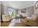 Cozy living room featuring hardwood floors, neutral color scheme, and comfortable seating arrangement at 346 Willet Ave, Apopka, FL 32703