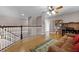 Spacious loft area featuring hardwood floors, a ceiling fan, and cozy seating at 346 Willet Ave, Apopka, FL 32703