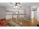 Cozy loft area with wood floors, ceiling fan, and comfortable seating at 346 Willet Ave, Apopka, FL 32703