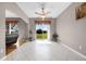 Sunlit sitting area with tile floors, ceiling fan, and sliding glass doors opening to the backyard at 346 Willet Ave, Apopka, FL 32703
