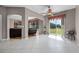 Bright sitting area features tile floors, ceiling fan, and backyard views through large sliding glass doors at 346 Willet Ave, Apopka, FL 32703